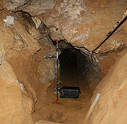Samples of dripping water are taken regularly in a cave with the KIT sample collector.