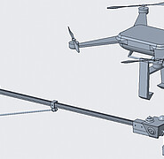 Messgräte, die nah an Stromleitungen positioniert sein sollen, werden von einem Ausleger gehalten, der dank Magnet- und Klemmtechnologie mit einer Drohne am Mast montiert werden kann. (Bild: Dr. Na Shen / KIT)