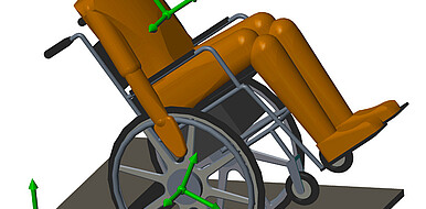 Possible use of the balancing assistant: A wheelchair user is supported semi-automatically when a step is lowered. In an tilted position, he crosses the obstacle.