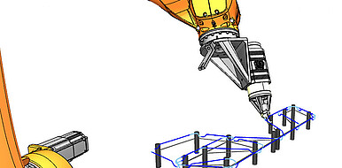 The robot-based manufacturing process produces continuous fiber-reinforced spatial lattice structures (CCFSLS) for industrial applications. A microwave print head developed at KIT enables the additive manufacturing of large-scale structures. (Image: FAST-LB)