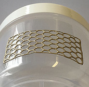 Curved honeycomb structures made of stretchable material on a curved surface.