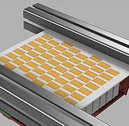 CAD model of the discharge system of the new sorting system: On the chute (white), objects detected by the camera system can be mechanically discharged in a pulsed manner. This is achieved by means of flaps (yellow) arranged in the array and actuators underneath, which eject the target object in a desired direction. (Image: Marcel Reith-Braun / KIT)